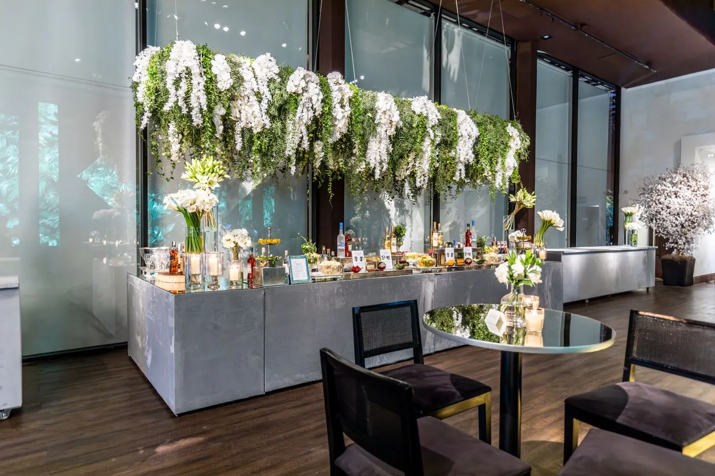 Wedding bar counter dressed with white flowers