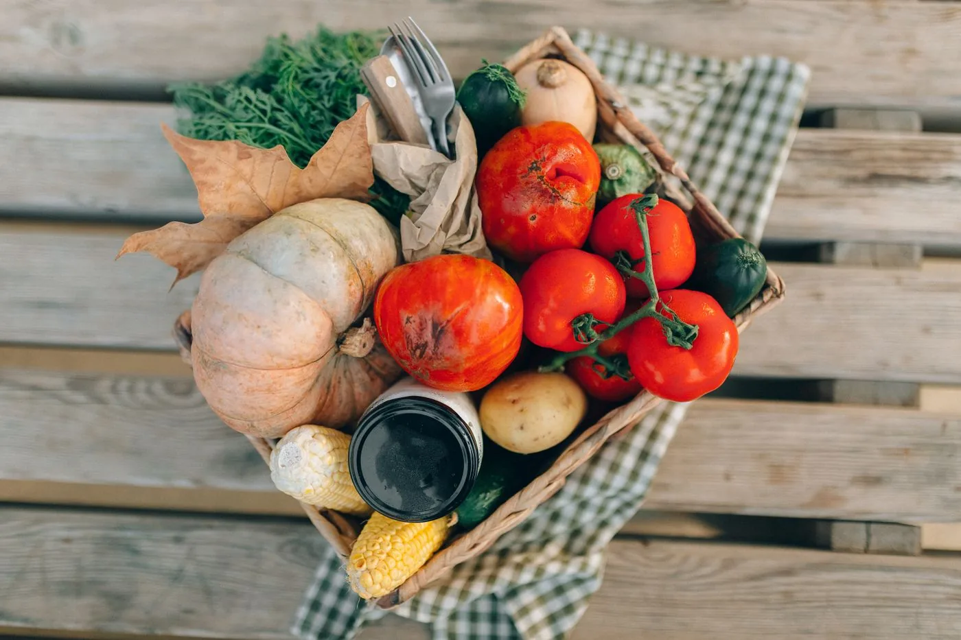 Fresh produce and harvest ingredients arranged in wooden crates